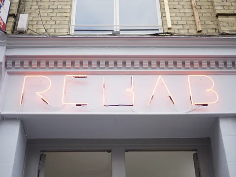 Salon photo (the REHAB neon sign), 2014, Barbican